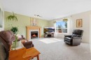 46 Somerside Place Sw, Calgary, AB  - Indoor Photo Showing Living Room With Fireplace 