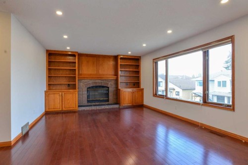 393 Hawktree Circle Nw, Calgary, AB - Indoor Photo Showing Living Room With Fireplace