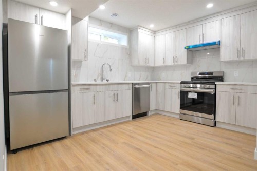 393 Hawktree Circle Nw, Calgary, AB - Indoor Photo Showing Kitchen With Stainless Steel Kitchen With Upgraded Kitchen