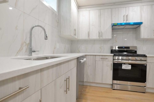393 Hawktree Circle Nw, Calgary, AB - Indoor Photo Showing Kitchen With Double Sink
