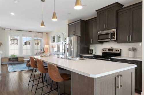 193 River Heights Drive, Cochrane, AB - Indoor Photo Showing Kitchen With Double Sink With Upgraded Kitchen