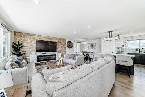 12 Rundleson Way Ne, Calgary, AB - Indoor Photo Showing Living Room With Fireplace