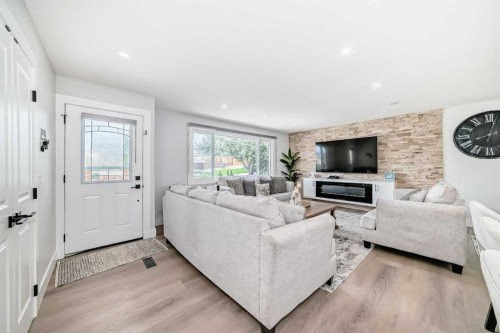 12 Rundleson Way Ne, Calgary, AB - Indoor Photo Showing Living Room With Fireplace
