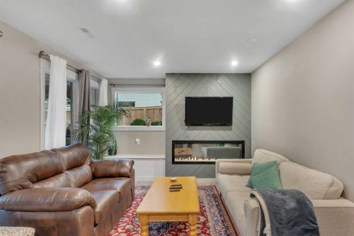 760 West Chestermere Drive, Chestermere, AB - Indoor Photo Showing Living Room With Fireplace