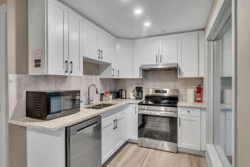 760 West Chestermere Drive, Chestermere, AB - Indoor Photo Showing Kitchen With Double Sink