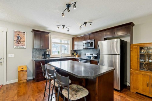 248 Cascades Pass, Chestermere, AB - Indoor Photo Showing Kitchen With Stainless Steel Kitchen