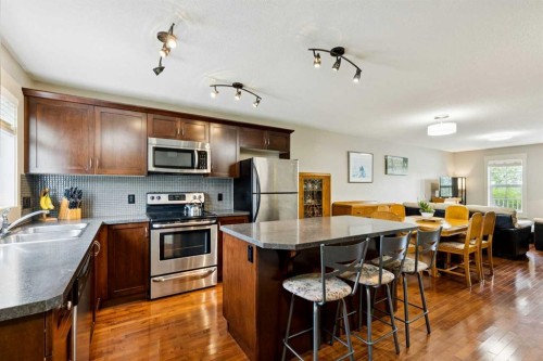 248 Cascades Pass, Chestermere, AB - Indoor Photo Showing Kitchen With Stainless Steel Kitchen With Double Sink