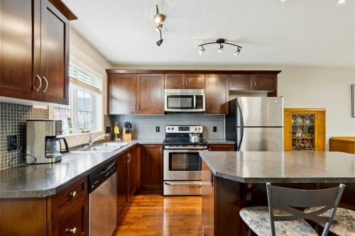 248 Cascades Pass, Chestermere, AB - Indoor Photo Showing Kitchen With Stainless Steel Kitchen With Double Sink