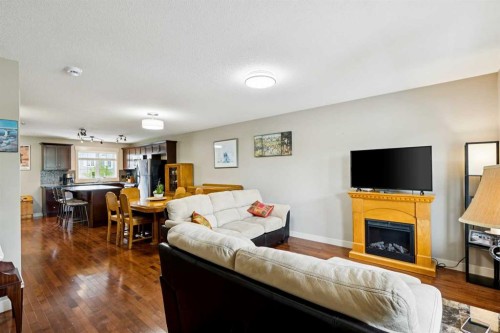 248 Cascades Pass, Chestermere, AB - Indoor Photo Showing Living Room With Fireplace