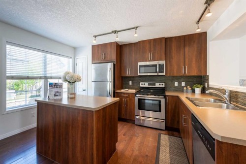 38 Cranford Drive Se, Calgary, AB - Indoor Photo Showing Kitchen With Stainless Steel Kitchen With Double Sink