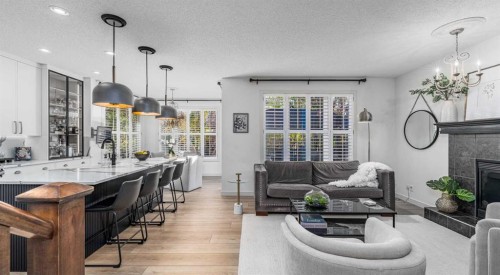77 Everbrook Drive Sw, Calgary, AB - Indoor Photo Showing Living Room With Fireplace