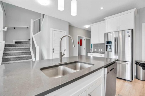 14 Evansfield Green Nw, Calgary, AB - Indoor Photo Showing Kitchen With Stainless Steel Kitchen With Double Sink