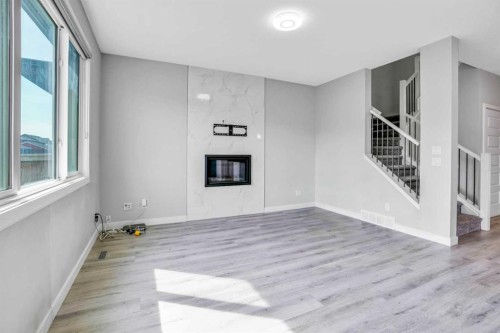 14 Evansfield Green Nw, Calgary, AB - Indoor With Fireplace