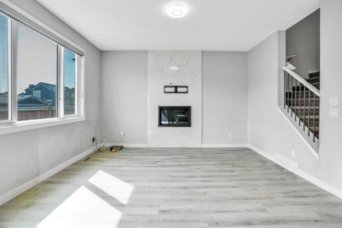14 Evansfield Green Nw, Calgary, AB - Indoor With Fireplace