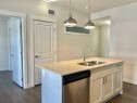 302-100 Auburn Meadows Common Se, Calgary, AB  - Indoor Photo Showing Kitchen With Double Sink 