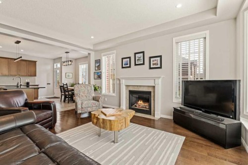 728 Windridge Road Sw, Airdrie, AB - Indoor Photo Showing Living Room With Fireplace