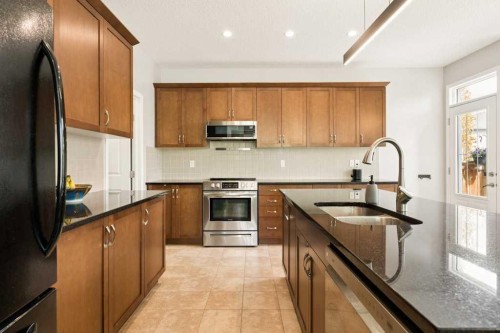 728 Windridge Road Sw, Airdrie, AB - Indoor Photo Showing Kitchen With Double Sink