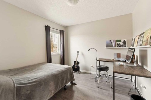 728 Windridge Road Sw, Airdrie, AB - Indoor Photo Showing Bedroom