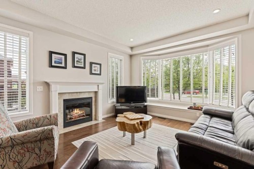 728 Windridge Road Sw, Airdrie, AB - Indoor Photo Showing Living Room With Fireplace