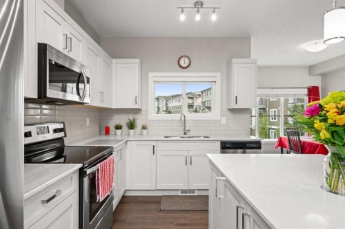 536 Cranford Drive Se, Calgary, AB - Indoor Photo Showing Kitchen With Upgraded Kitchen