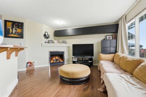 555 Panamount Boulevard, Calgary, AB - Indoor Photo Showing Living Room With Fireplace