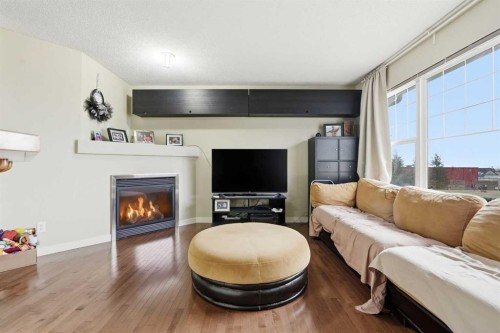 555 Panamount Boulevard, Calgary, AB - Indoor Photo Showing Living Room With Fireplace