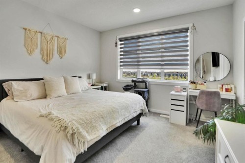112 Langwell Common Se, Airdrie, AB - Indoor Photo Showing Bedroom