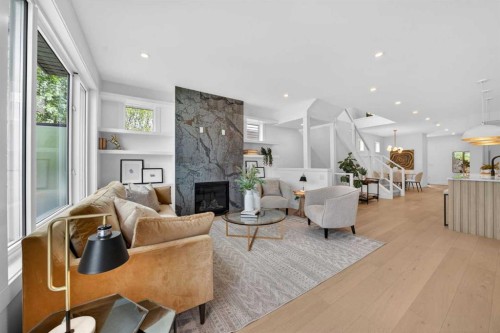 602 25 Avenue Ne, Calgary, AB - Indoor Photo Showing Living Room With Fireplace