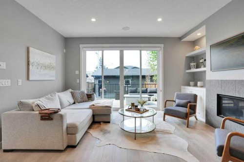 4405 20 Avenue Nw, Calgary, AB - Indoor Photo Showing Living Room With Fireplace