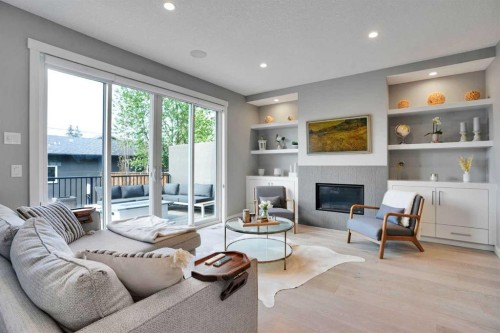 4405 20 Avenue Nw, Calgary, AB - Indoor Photo Showing Living Room With Fireplace