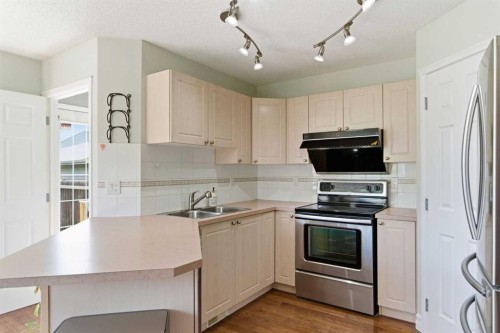 204 Citadel Bluff Close Nw, Calgary, AB - Indoor Photo Showing Kitchen With Double Sink