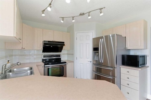 204 Citadel Bluff Close Nw, Calgary, AB - Indoor Photo Showing Kitchen With Double Sink