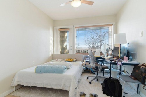 210-69 Springborough Court Sw, Calgary, AB - Indoor Photo Showing Bedroom