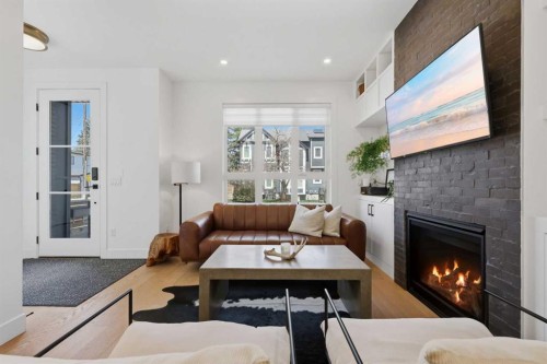 3707 30 Avenue Sw, Calgary, AB - Indoor Photo Showing Living Room With Fireplace