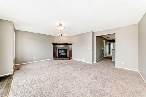 196 Cranberry Circle Se, Calgary, AB - Indoor Photo Showing Living Room With Fireplace