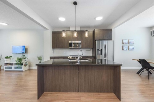 82-300 Marina Drive, Chestermere, AB - Indoor Photo Showing Kitchen With Stainless Steel Kitchen With Double Sink