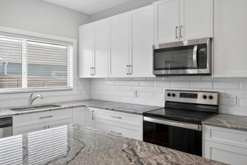 326 Creekside Boulevard Sw, Calgary, AB - Indoor Photo Showing Kitchen With Upgraded Kitchen