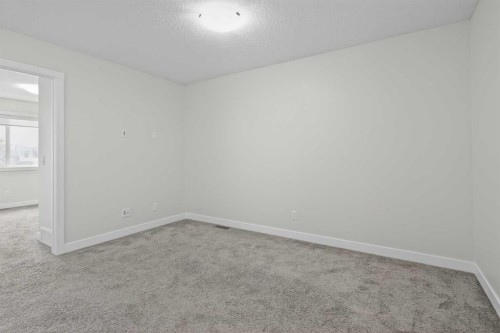 326 Creekside Boulevard Sw, Calgary, AB - Indoor Photo Showing Other Room