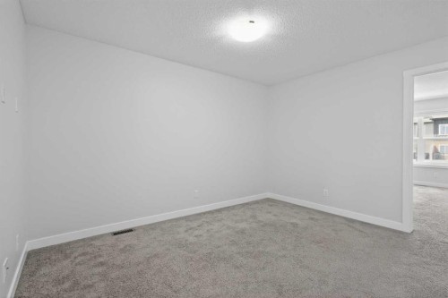 326 Creekside Boulevard Sw, Calgary, AB - Indoor Photo Showing Other Room