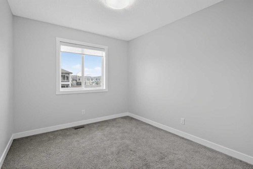 326 Creekside Boulevard Sw, Calgary, AB - Indoor Photo Showing Other Room