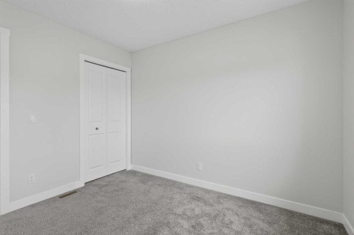 326 Creekside Boulevard Sw, Calgary, AB - Indoor Photo Showing Other Room