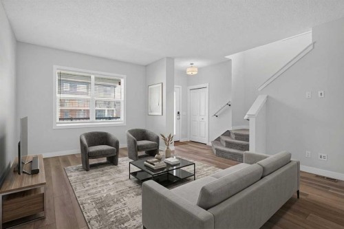 326 Creekside Boulevard Sw, Calgary, AB - Indoor Photo Showing Living Room