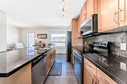 25 Aspen Hills Terrace Sw, Calgary, AB - Indoor Photo Showing Kitchen With Stainless Steel Kitchen With Upgraded Kitchen