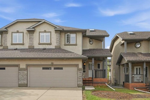 37 Prominence Park Sw, Calgary, AB - Outdoor With Facade