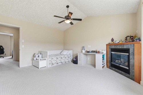 37 Prominence Park Sw, Calgary, AB - Indoor With Fireplace