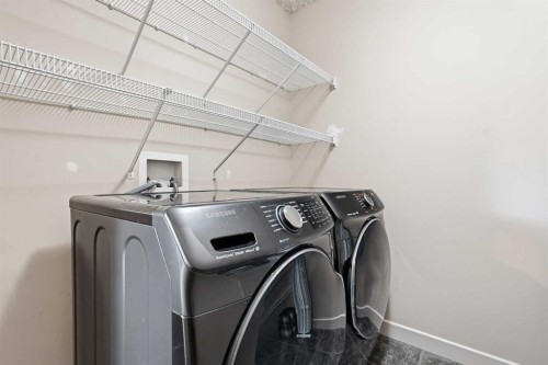 37 Prominence Park Sw, Calgary, AB - Indoor Photo Showing Laundry Room