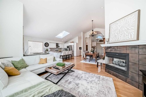 243 Mt Assiniboine Circle Se, Calgary, AB - Indoor Photo Showing Living Room With Fireplace