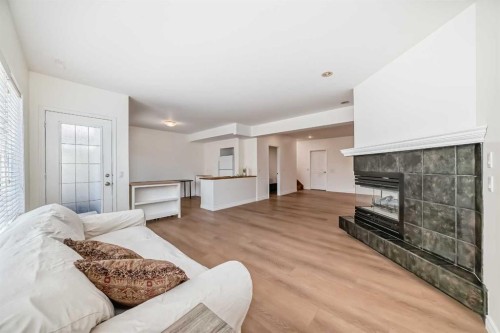 243 Mt Assiniboine Circle Se, Calgary, AB - Indoor Photo Showing Living Room With Fireplace
