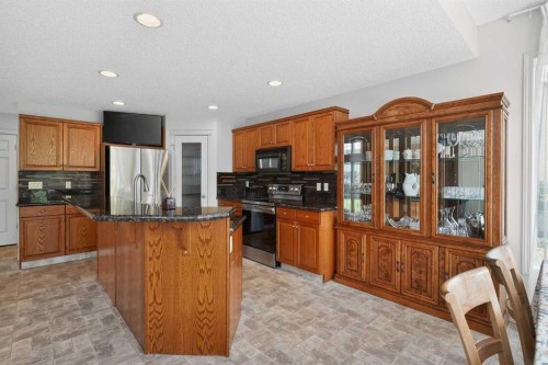 98 Cougarstone Close Sw, Calgary, AB - Indoor Photo Showing Kitchen With Stainless Steel Kitchen