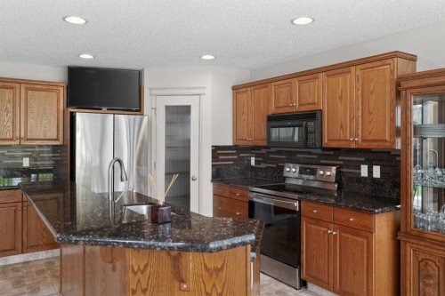 98 Cougarstone Close Sw, Calgary, AB - Indoor Photo Showing Kitchen With Stainless Steel Kitchen